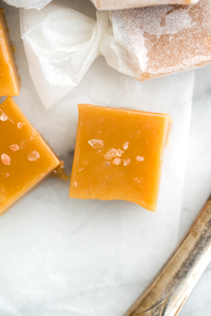 Salted Kentucky Bourbon Caramels. Sticky, gooey, bourbon enhanced caramel candy. An addicting candy classic. | thesugarcoatedcottage.com #caramel #candy