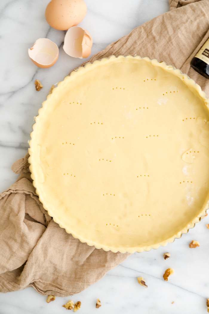 Walnut Rum Tart. Walnuts, salted caramel and rum all wrapped in a buttery crust. The filling is soft, delicate and crumbly. | thesugarcoatedcottage.com