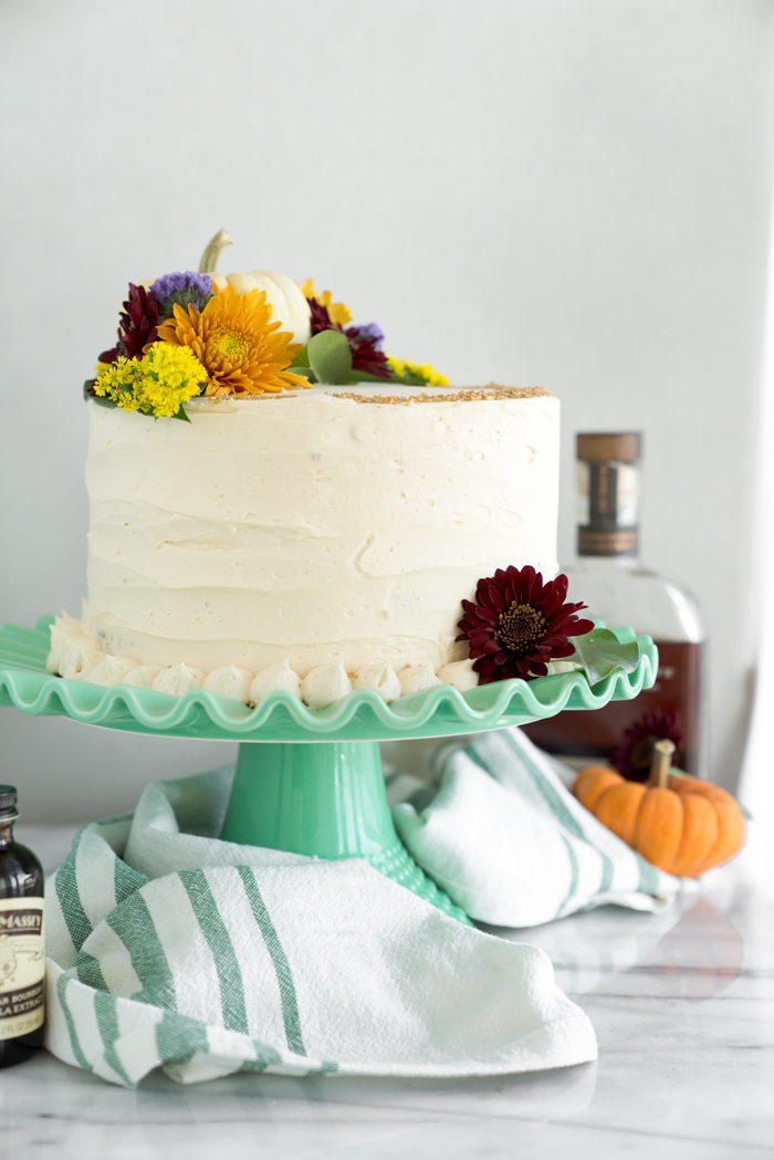 Pumpkin Cake with Salted Caramel Bourbon Buttercream. The only dessert you'll ever need this Thanksgiving. Perfectly spiced, unbelievable texture. | thesugarcoatedcottage.com