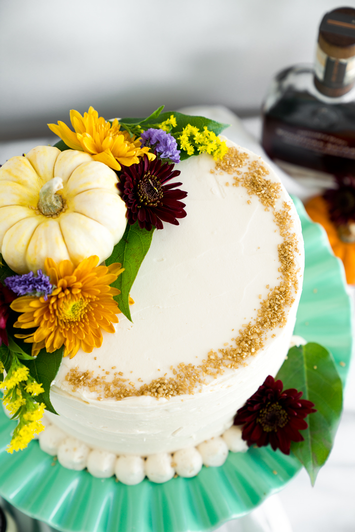 Pumpkin Cake with Salted Caramel Bourbon Buttercream. The only dessert you'll ever need this Thanksgiving. Perfectly spiced, unbelievable texture. | thesugarcoatedcottage.com