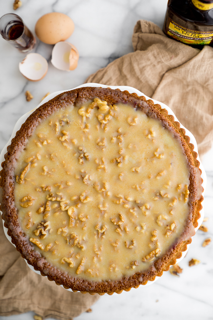 Walnut Rum Tart. Walnuts, salted caramel and rum all wrapped in a buttery crust. The filling is soft, delicate and crumbly. | thesugarcoatedcottage.com