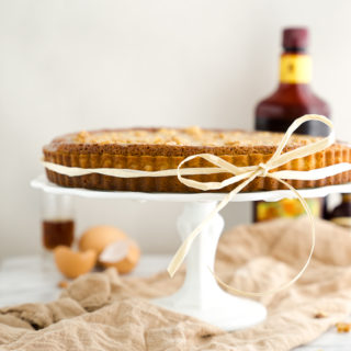 Walnut Rum Tart. Walnuts, salted caramel and rum all wrapped in a buttery crust. The filling is soft, delciate and crumbly. | thesugarcoatedcottage.com
