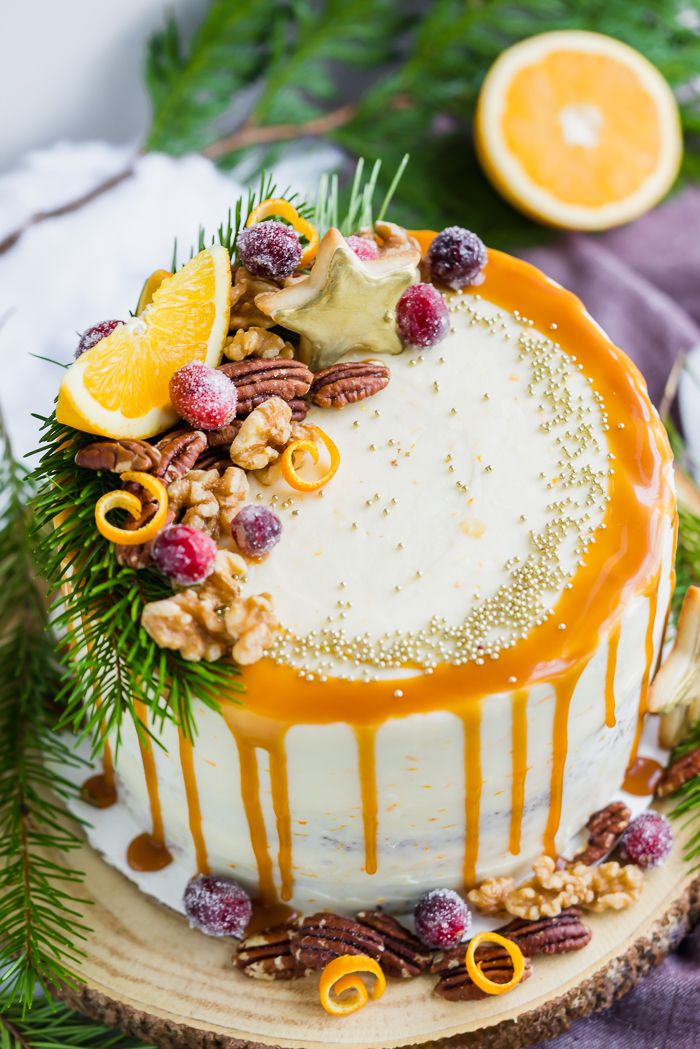 Gingerbread Orange Layer Cake. Three layers of orangey rum glazed gingerbread cake coated in an orangey cream cheese buttercream!! | gingerbread, cake