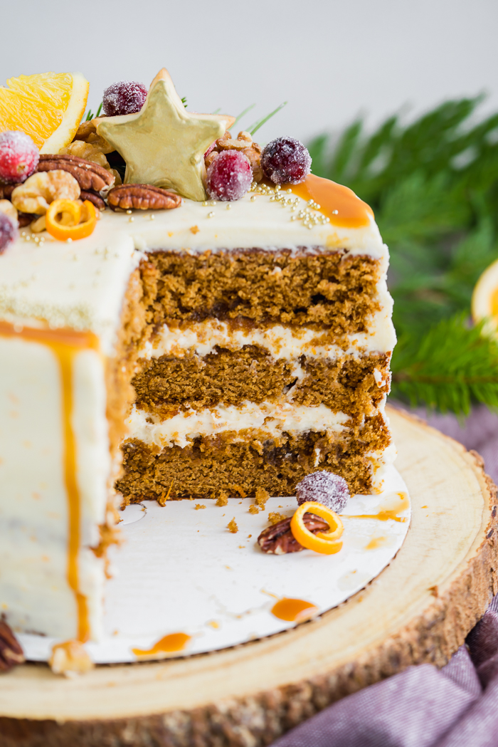 Gingerbread Orange Layer Cake. Three layers of orangey rum glazed gingerbread cake coated in an orangey cream cheese buttercream!! | gingerbread, cake www. thesugarcoatedcottage.com