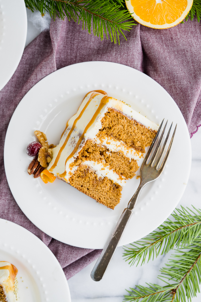 Gingerbread Orange Layer Cake. Three layers of orangey rum glazed gingerbread cake coated in an orangey cream cheese buttercream!! | gingerbread, cake www. thesugarcoatedcottage.com