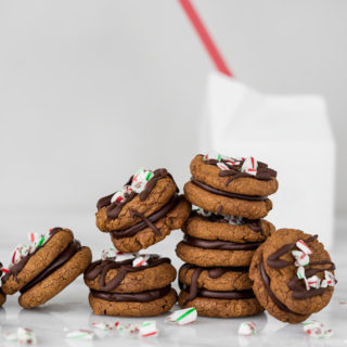 Peppermint Ganache Sandwich Cookies. Crunchy on the outside, soft on the inside chocolate cookies sandwich smooth and creamy peppermint ganache! | www.thesugarcoatedcottage.com | @NielsenMassey, cookies, ganache, sandwich cookie, oreo, peppermint, holiday, christmas