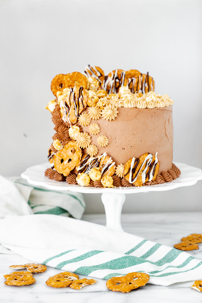 Chocolate Peanut Butter Cake. Hershey's famous chocolate cake filled with creamy peanut butter buttercream. #cake #peanutbutter #chocolate
