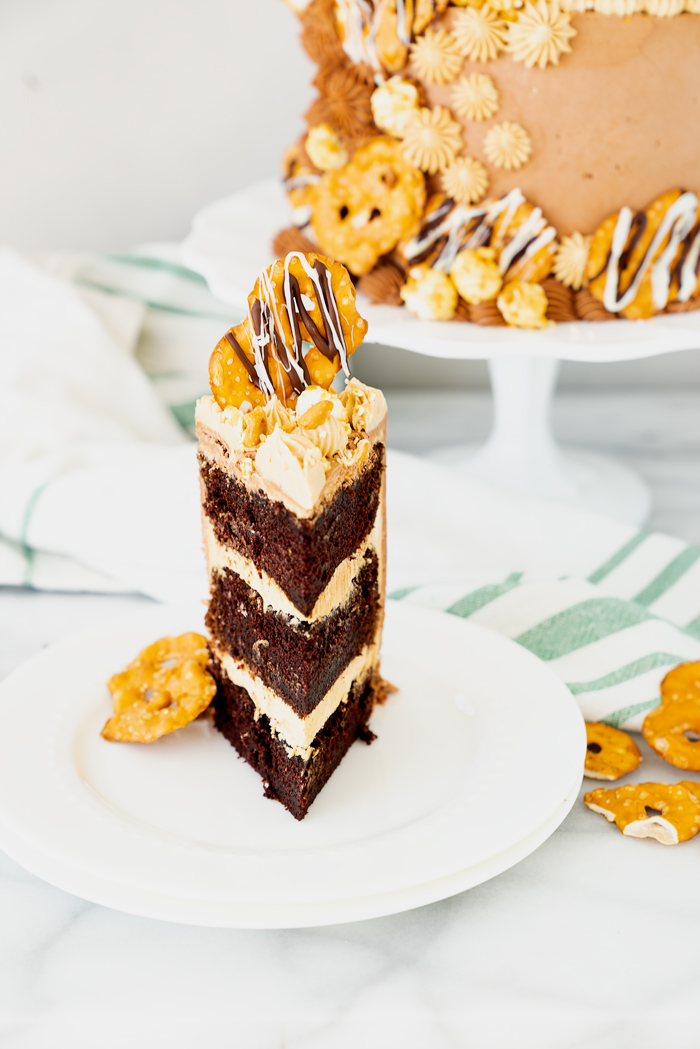 Chocolate Peanut Butter Cake. Hershey's famous chocolate cake filled with creamy peanut butter buttercream. #cake #peanutbutter #chocolate