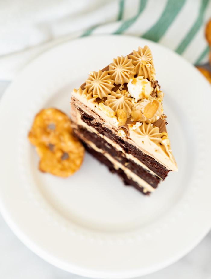 Chocolate Peanut Butter Cake. Hershey's famous chocolate cake filled with creamy peanut butter buttercream. #cake #peanutbutter #chocolate