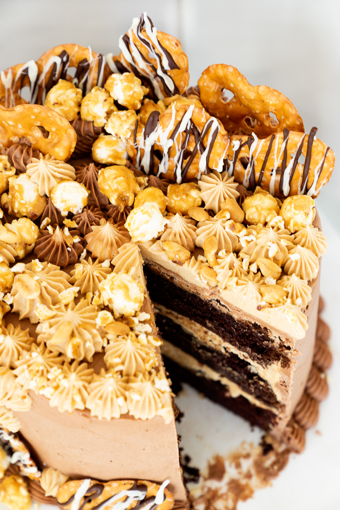 Chocolate Peanut Butter Cake. Hershey's famous chocolate cake filled with creamy peanut butter buttercream. #cake #peanutbutter #chocolate