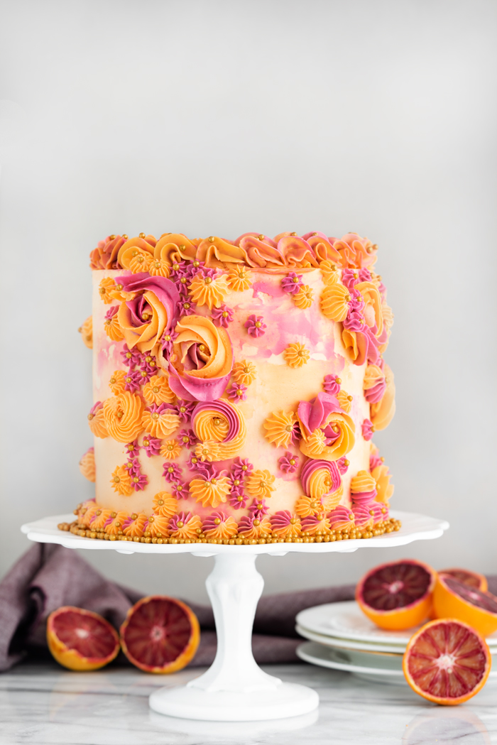 Blood Orange Cake. Blood orange scented cake layered with fresh blood orange curd. | thesugarcoatedcottage.com #bloodorange #orangecurd #cake #buttercream