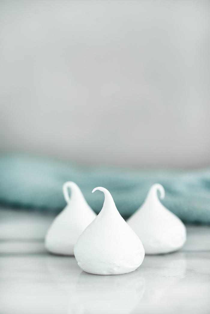 Meringue Kisses Recipe. The perfect dollop of meringue baked into a crispy on the outside, chewy on the inside cookie. | thesugarcoatedcottage.com #merignue