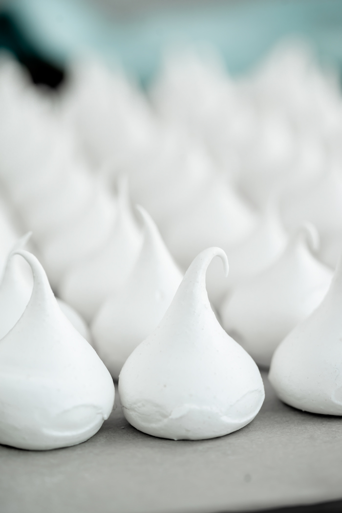 Meringue Kisses Recipe. The perfect dollop of meringue baked into a crispy on the outside, chewy on the inside cookie. | thesugarcoatedcottage.com #merignue