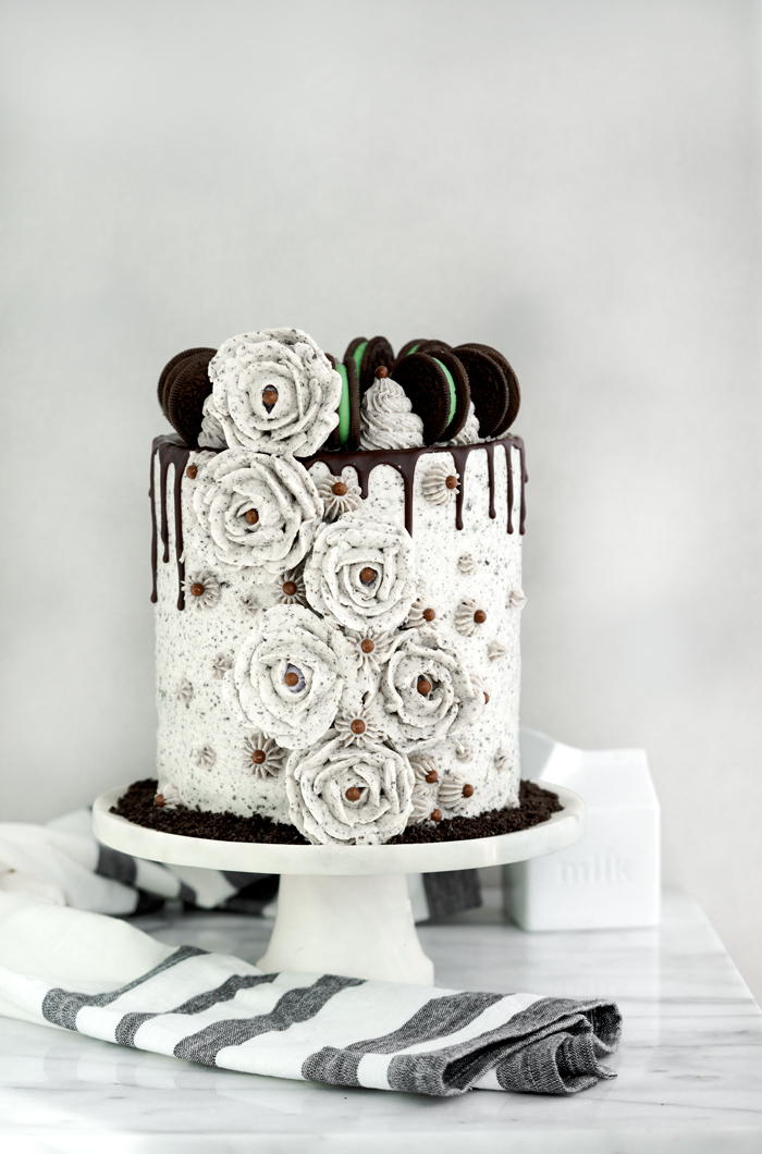 Mint Oreo Cookie Cake. Minty, chocolatey, layer cake, decorated with Mint Oreo speckled buttercream roses. | thesugarcoatedcottage.com #cakedecorating #oreocake #buttercreamroses #cake