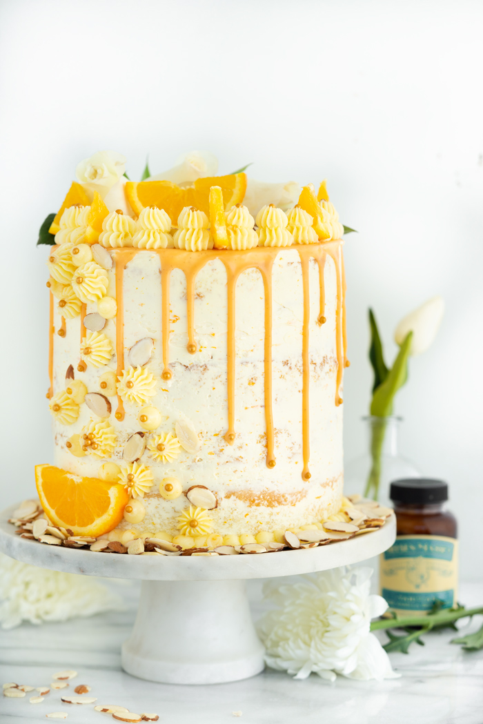 Vanilla Orange Almond Cake Recipe. Vanilla orange and almond soaked cake with layers of vanilla orange almond buttercream. | thesugarcoatedcottage.com #cake 