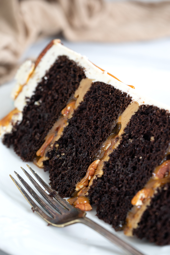 Pecan Turtle Cake - Chocolate, pecans and caramel make this cake awesome. cake, recipe, pecan turtles, candy, layer cakes, cake decorating