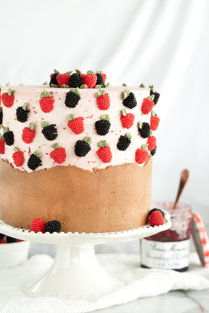 Raspberry Chocolate Cake. Addicting layers of deep chocolate cake. Filled with raspberry and both raspberry and chocolate buttercream! #cake #buttercream