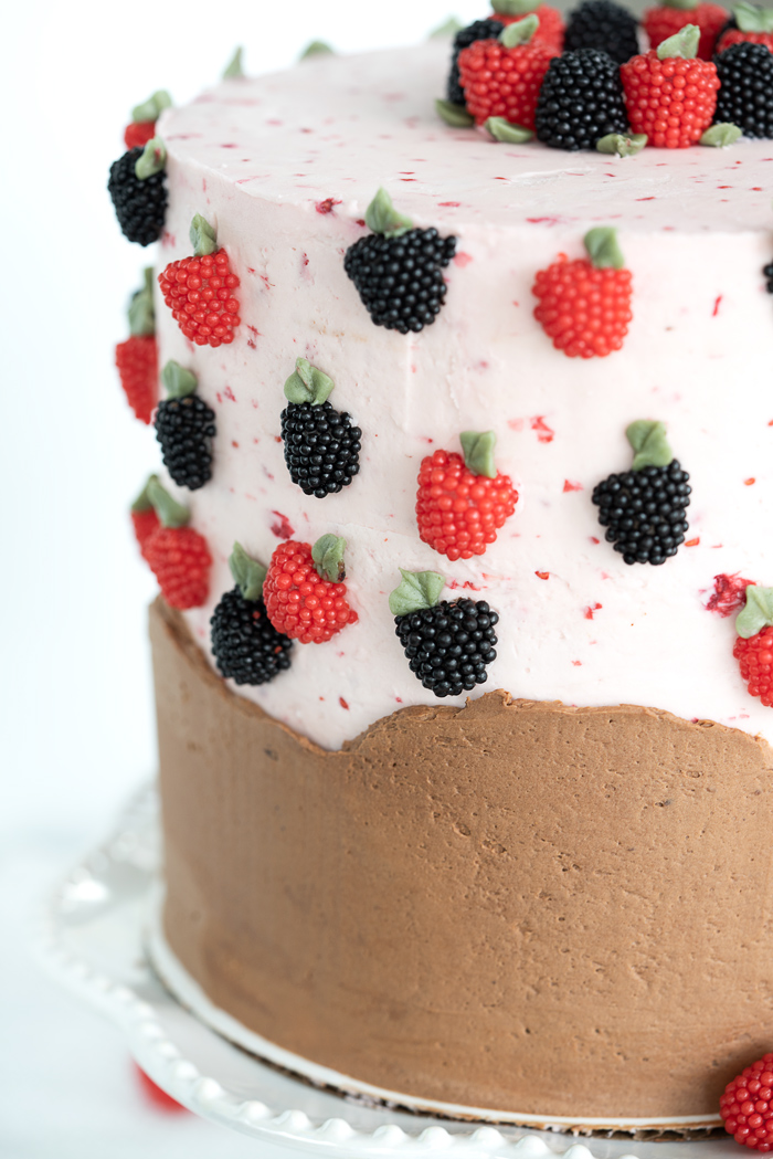 Raspberry Chocolate Cake. Addicting layers of deep chocolate cake. Filled with raspberry and both raspberry and chocolate buttercream! #cake #buttercream