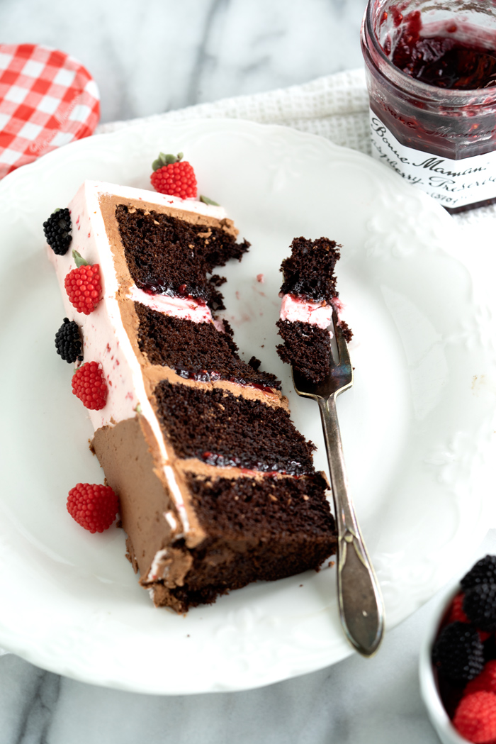 Raspberry Chocolate Cake. Addicting layers of deep chocolate cake. Filled with raspberry and both raspberry and chocolate buttercream! #cake #buttercream