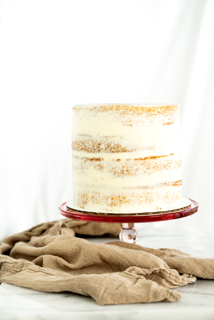 A step by step tutorial on how to properly fill and crumb coat a cake. thesugarcoatedcottage.com | #cake decorating, #crumb coat, #cake