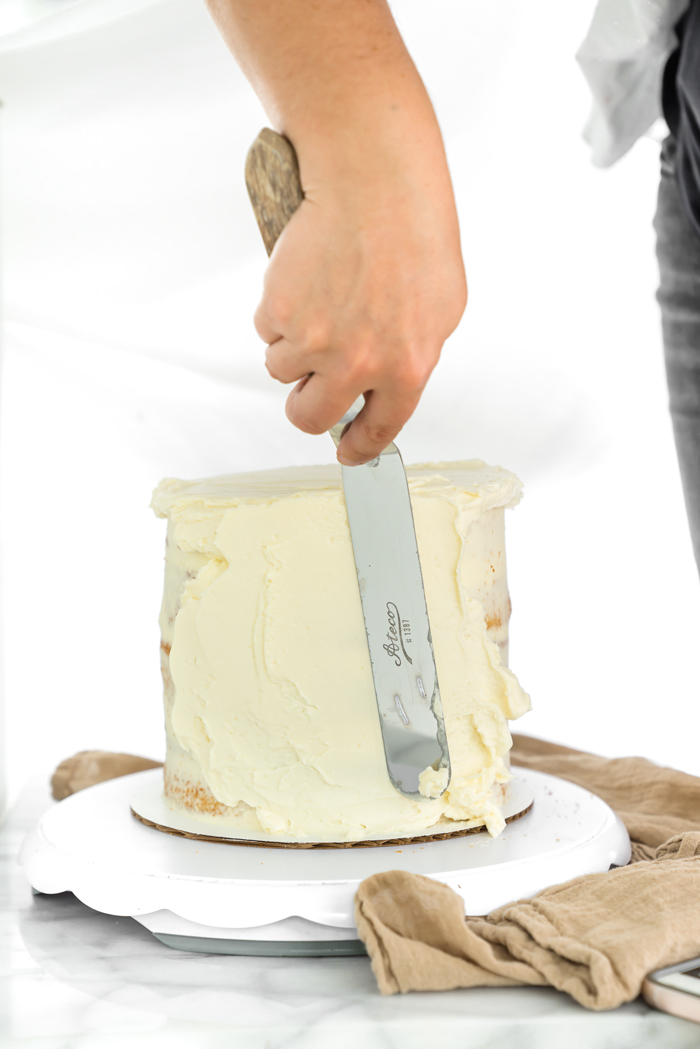 How To Create A Smooth Buttercream Finish. Step by step tutorial on how to get that coveted smooth buttercream finish. | thesugarcoatedcottage.com #cakedecoarting #buttercream #cake #dessert #recipe