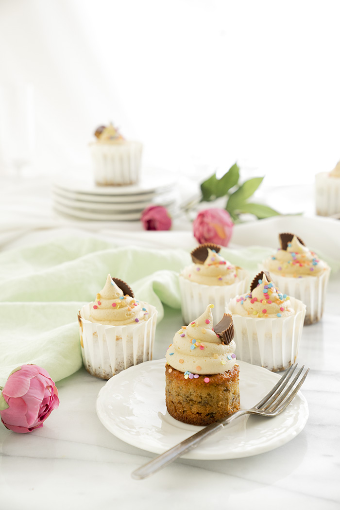 Banana Cupcakes with Peanut Butter Buttercream. Moist, delicious banana cupcakes and a swirl of peanut butter buttercream. #cupcake #banana #peanutbutter