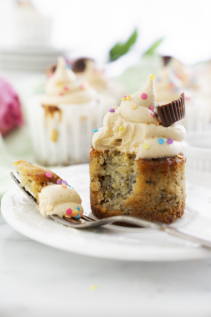 Banana Cupcakes with Peanut Butter Buttercream. Moist, delicious banana cupcakes and a swirl of peanut butter buttercream. #cupcake #banana #peanutbutter