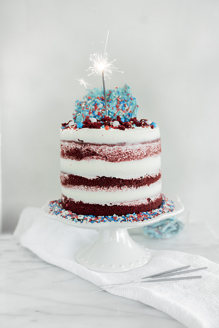 4th of July Red Velvet Cheesecake Cake. Moist, tender crumb red velvet cake with layers of whipped cheesecake filling. #4thofjuly #redvelvet #cheesecake