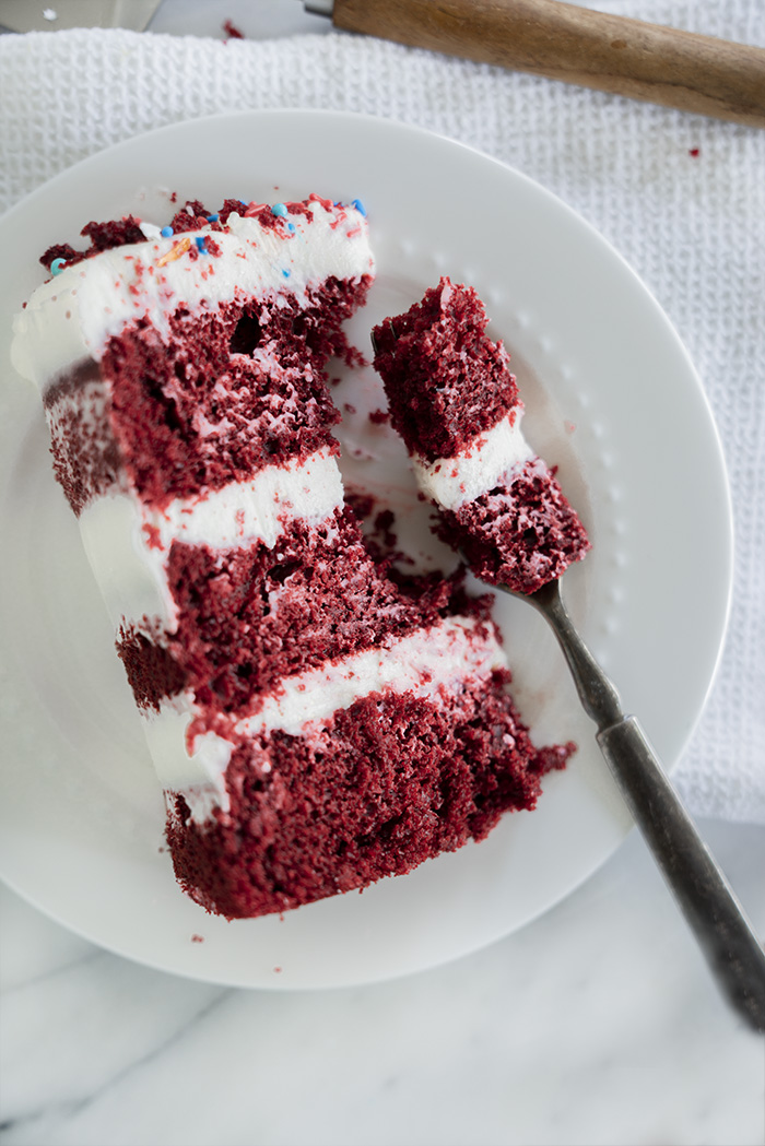 4th of July Red Velvet Cheesecake Cake. Moist, tender crumb red velvet cake with layers of whipped cheesecake filling. #4thofjuly #redvelvet #cheesecake #cake #redvelvetcheesecake