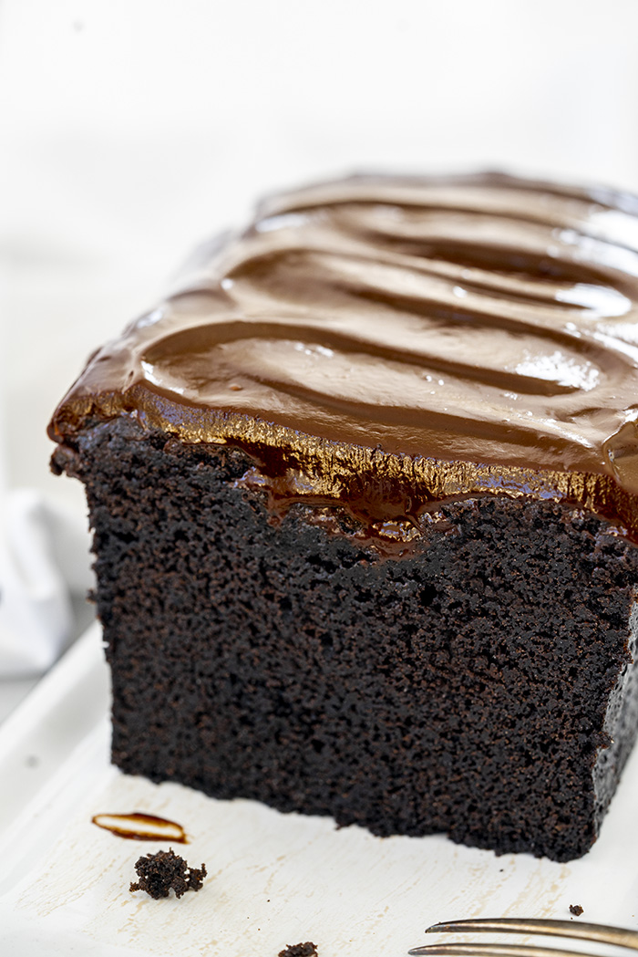 close up of whole black cocoa pound cake after slice