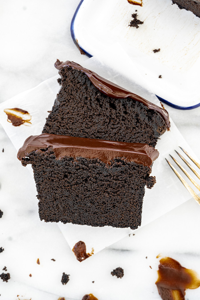 sliced black cocoa pound cake with dark chocolate ganache