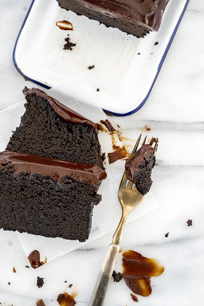 Slices of chocolate pound cake with chocolate ganache tiopping